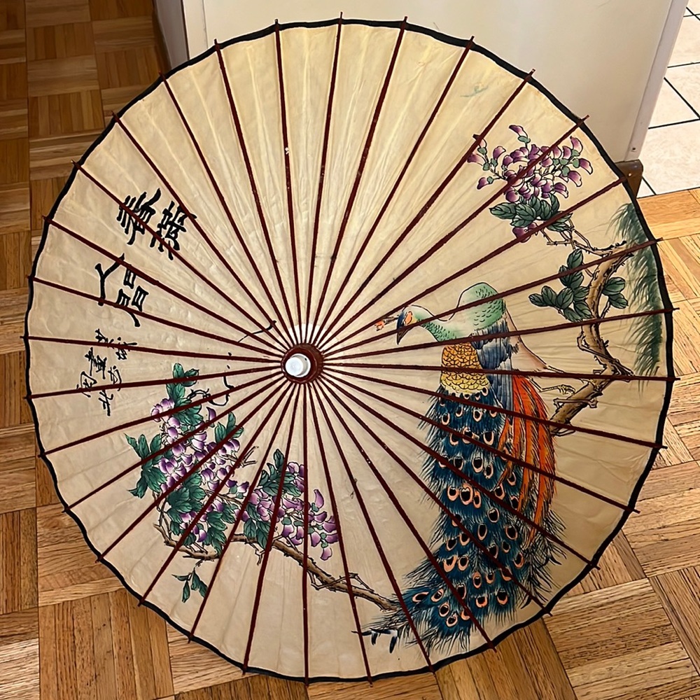Vintage Asian wooden umbrella with beautiful graphics